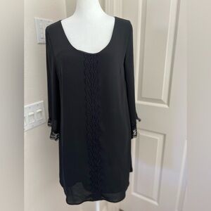 Astor loose fit black rayon dress deep v in back. Above knee